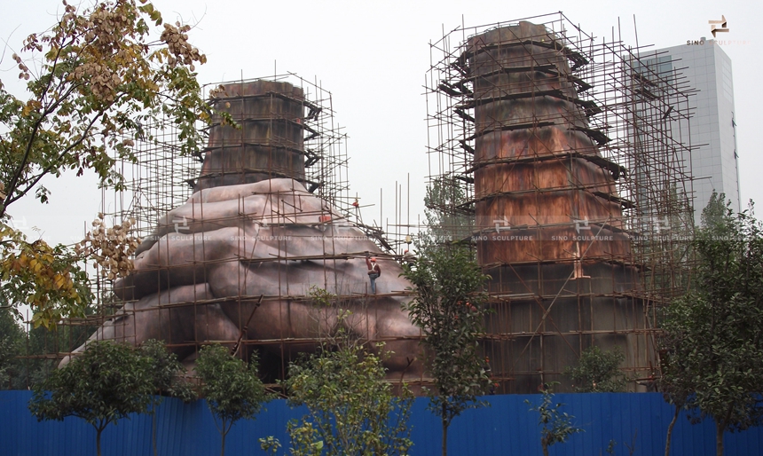 assembling of the large hand sculpture by sino sculpture team at site