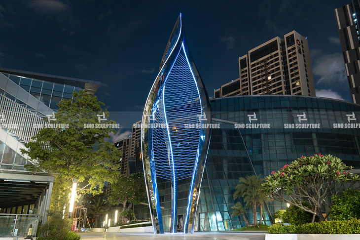 Forged stainless steel spiral sculpture night view