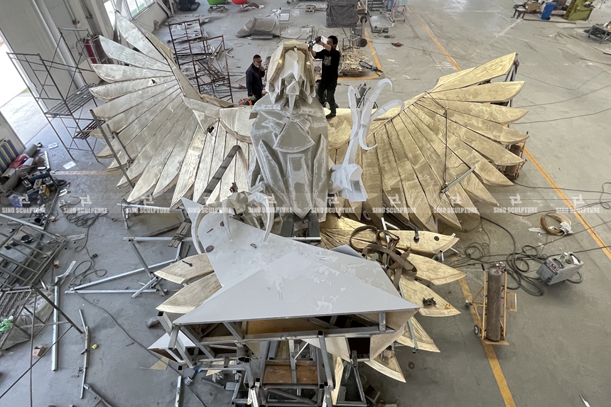 Spray-Painted-Brass-Falcon-Sculpture-Pre-installation